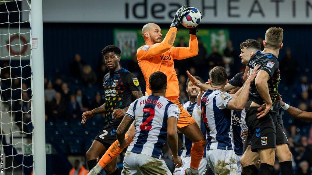 New Reading goalkeeper David Button makes a save whilst playing for West Bromwich Albion in the Championship last season 2022-23.