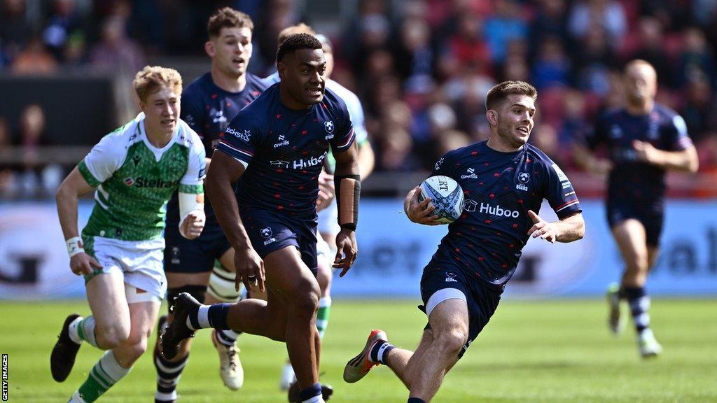 Harry Randall runs with the ball