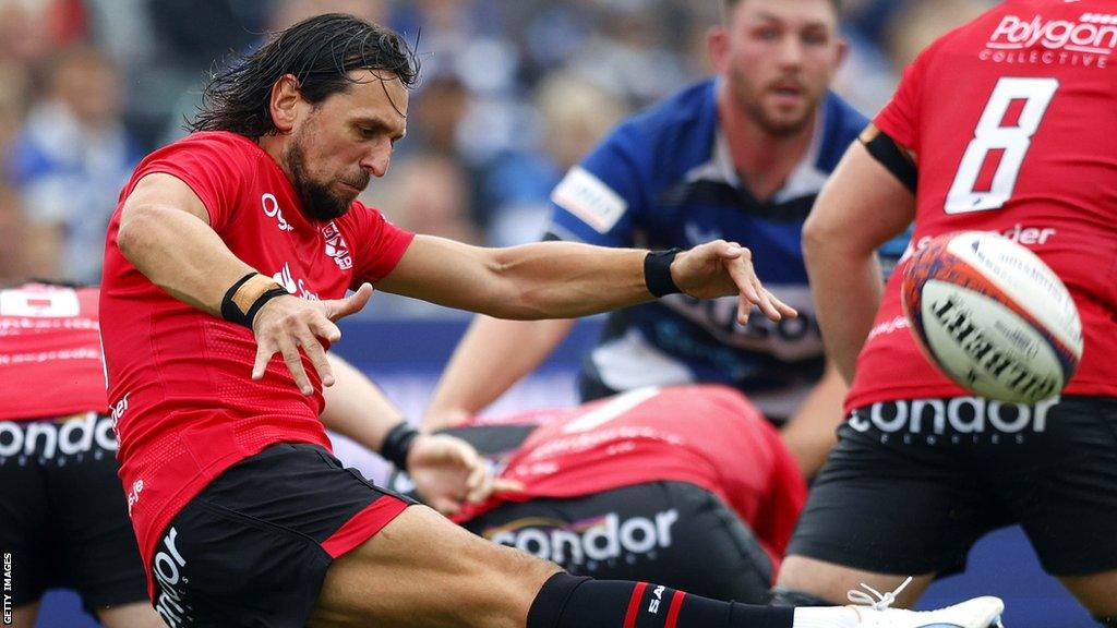 James Mitchell kicks the ball against Bath