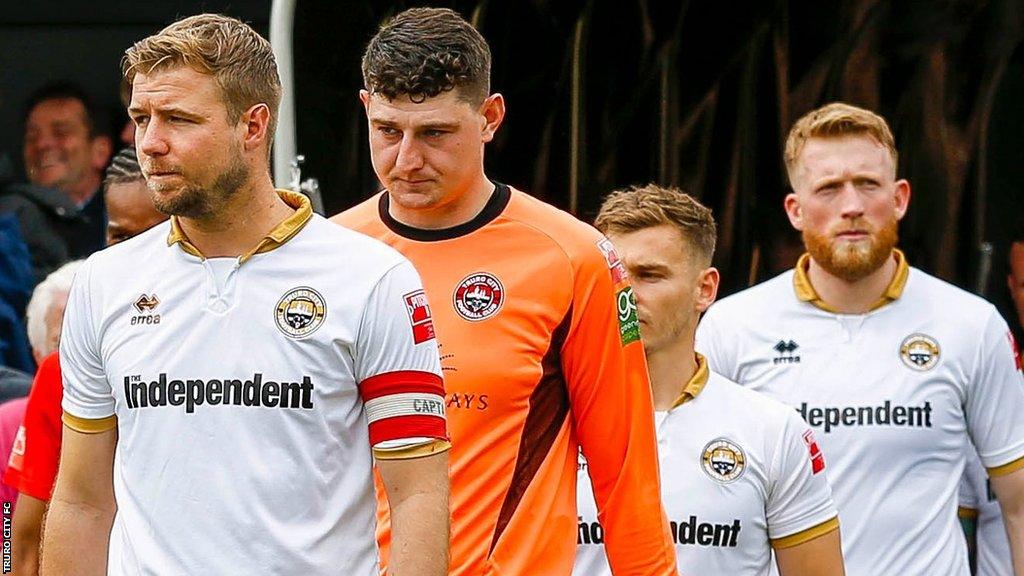 Truro City players walk out for a match