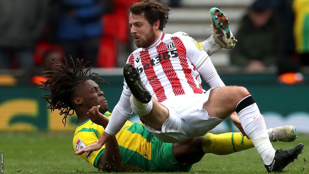 Stoke midfielder Ben Pearson (right) in a challenge with West Bromwich Albion's Brandon Thomas-Asante