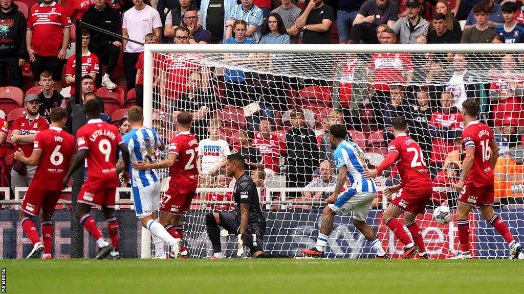 Dael Fry scores an own goal as Middlesbrough play Huddersfield