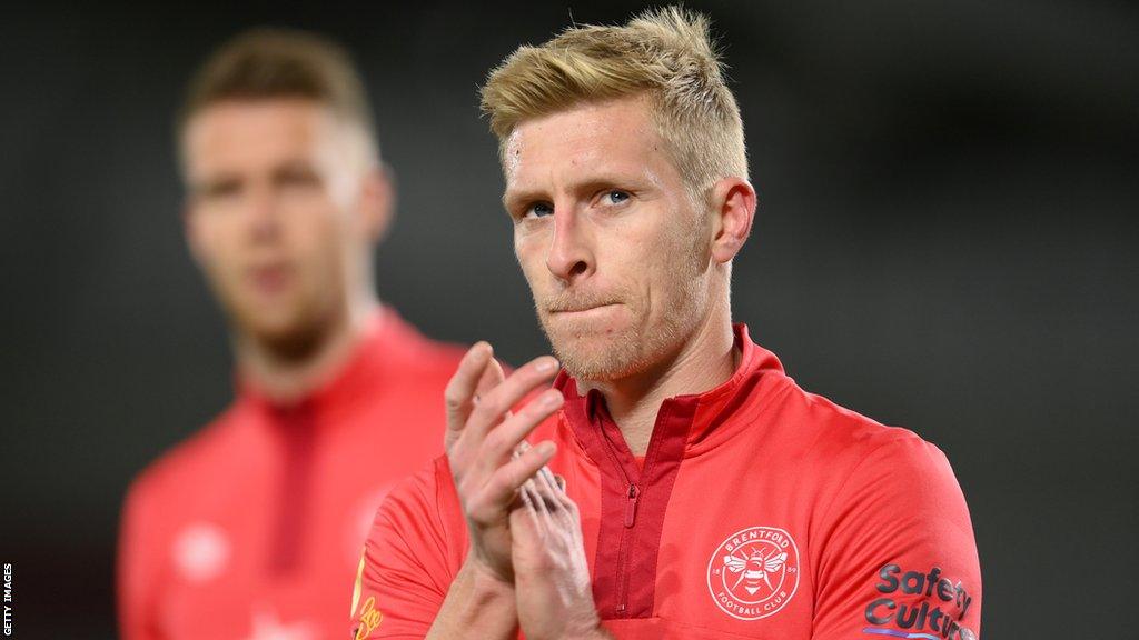 Ben Mee claps the Brentford fans