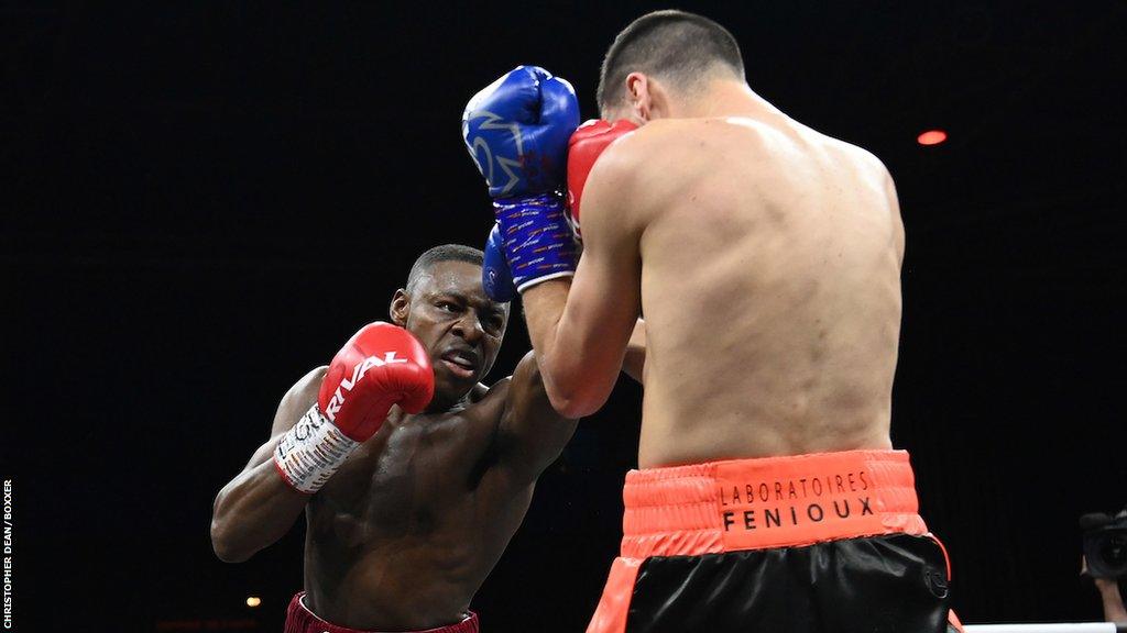 Dan Azeez throws a punch against Thomas Faure in Paris