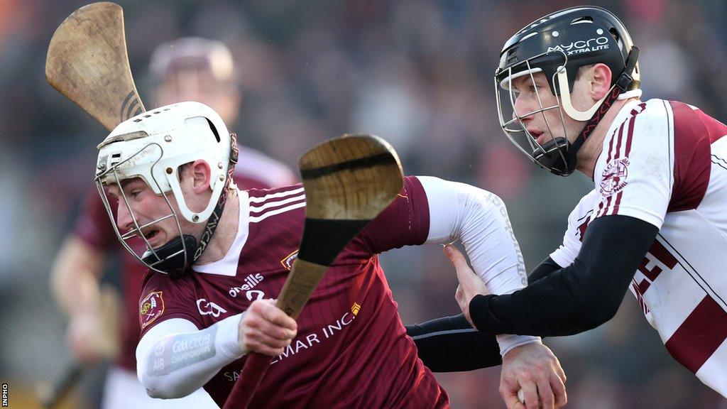 Paddy Burke attempts to burst away from Brendan Rogers at Pairc Esler