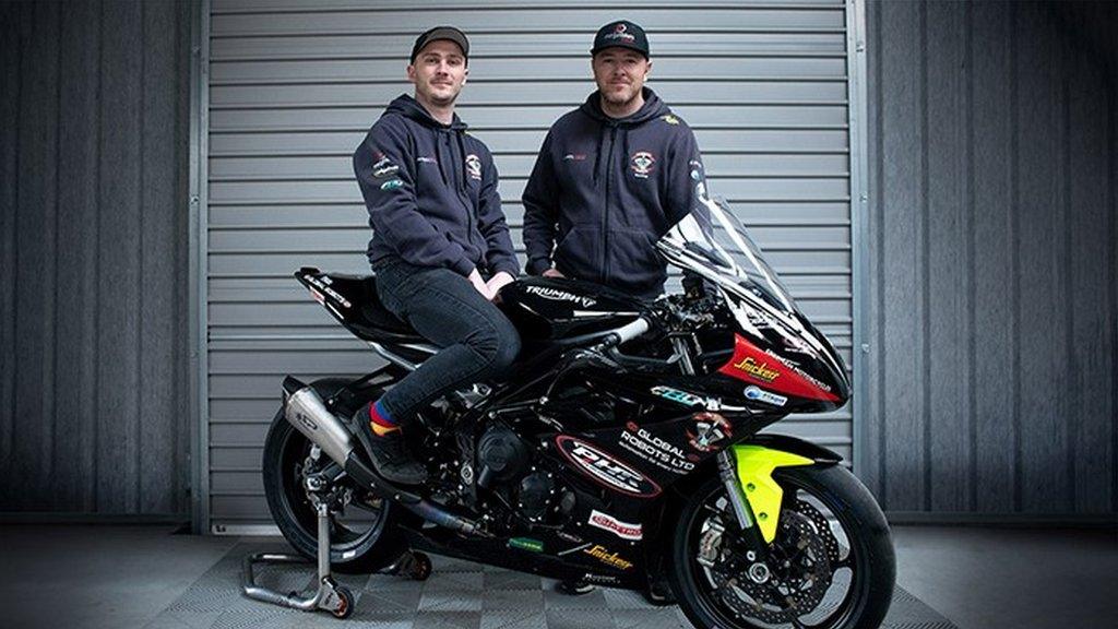 Eoin O'Siochru and Brian McCormack with a team bike