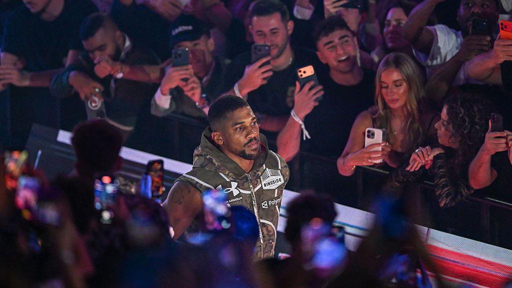 Anthony Joshua during his ring walk before his match against Jake Paul.
