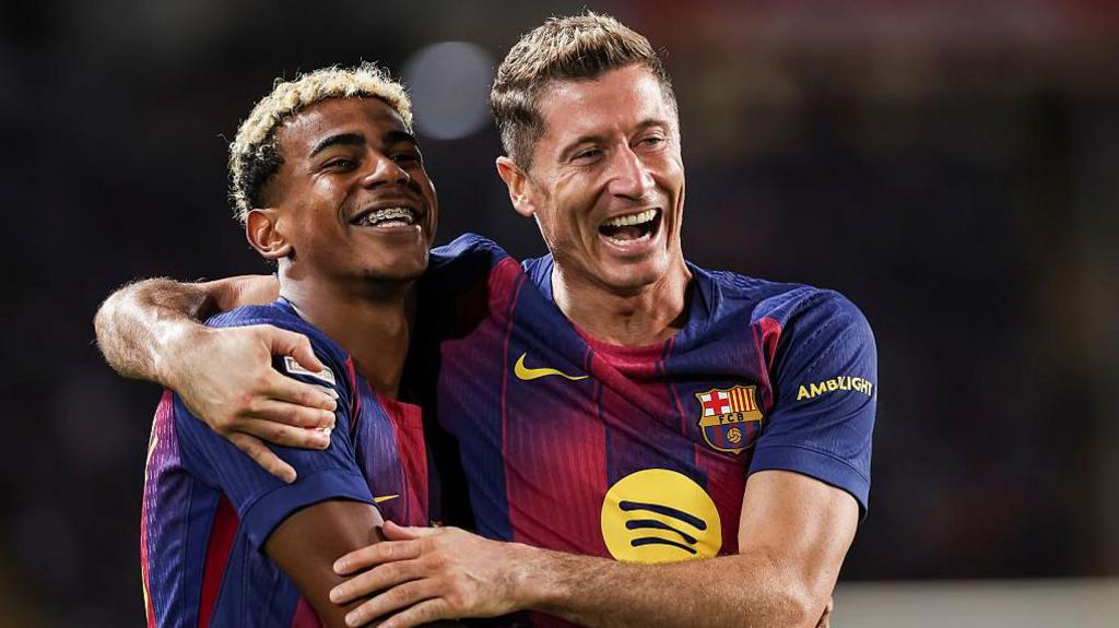 Barcelona players Robert Lewandowski and Lamine Yamal celebrate