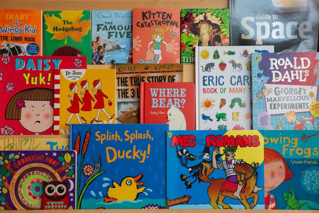 Children's book selection on bookshelf including an Eric Carle collection and a Dr Seuss book