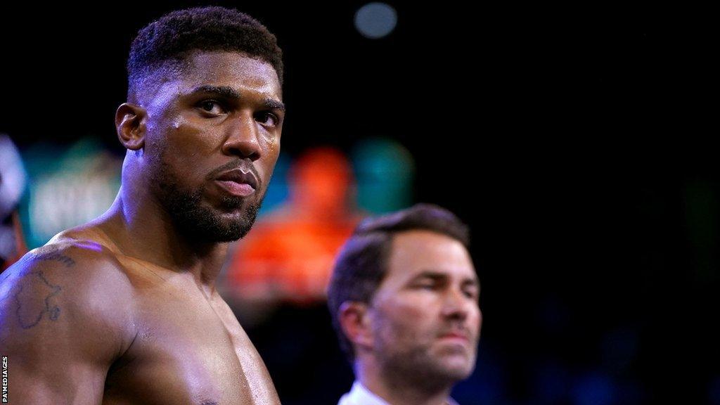 A photo of boxing star Anthony Joshua and promoter Eddie Hearn