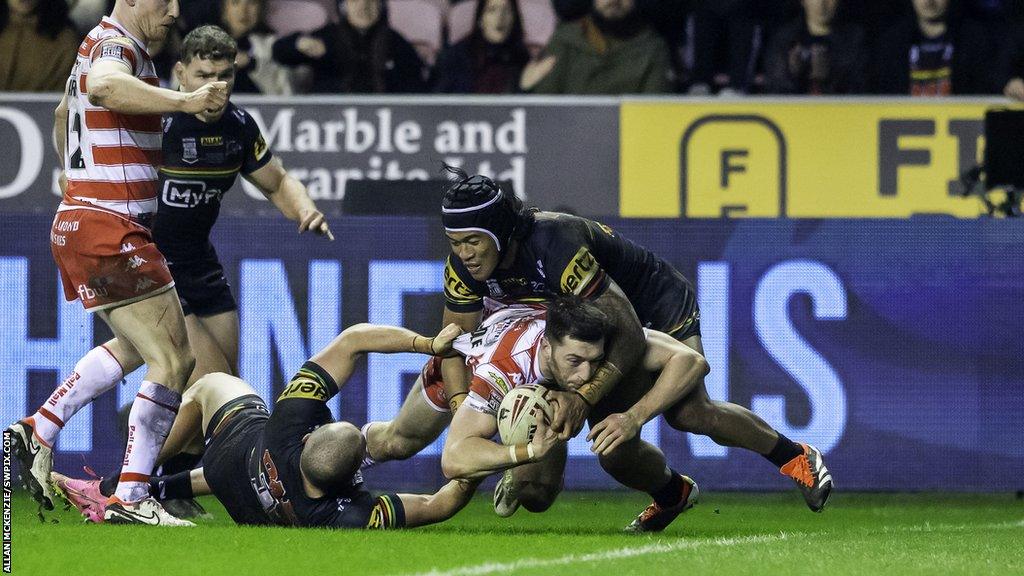 Rugby League - Betfred World Club Challenge - Wigan Warriors v Penrith Panthers - DW Stadium, Wigan, England - Wigan's Jake Wardle on his way to a try against Penrith.