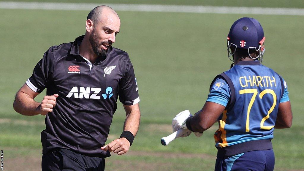 New Zealand's Daryl Mitchell celebrates taking the wicket of Sri Lanka's Charith Asalanka in the third one-day international in Hamilton