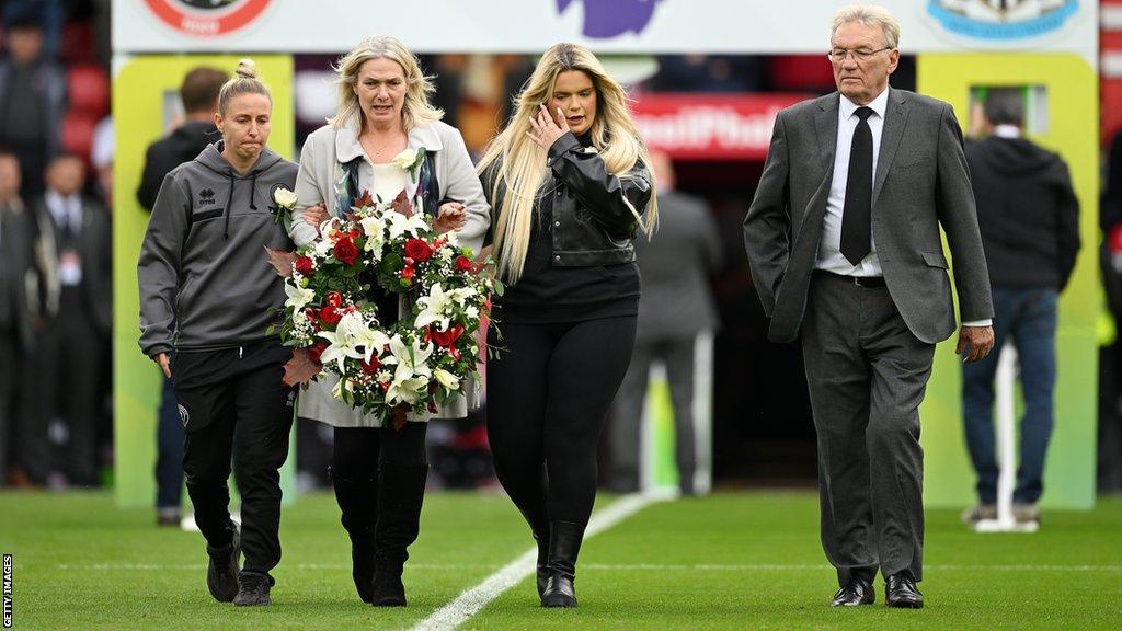 Members of Maddy Cusack's family with Sheffield United captain Sophie Brown and former player Tony Currie