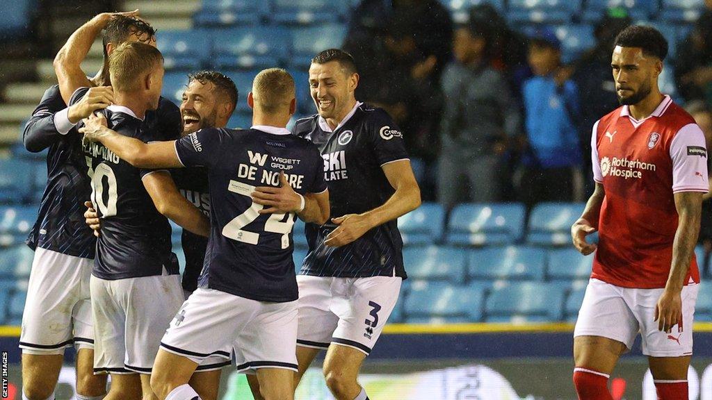 Millwall players celebrate a goal against Rotherham in the Championship