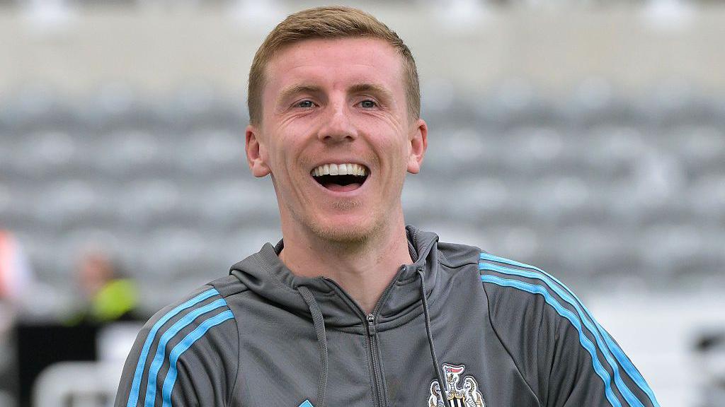 Matt Targett, pictured smiling during pre-season for Newcastle
