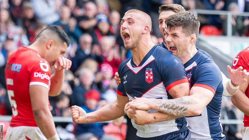 Mikey Lewis celebrates his try on England debut