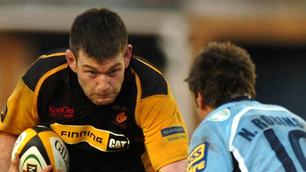 Michael Owen takes on Cardiff Blues' Nicky Robinson in May, 2007