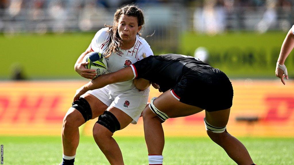 Abbie Ward playing rugby