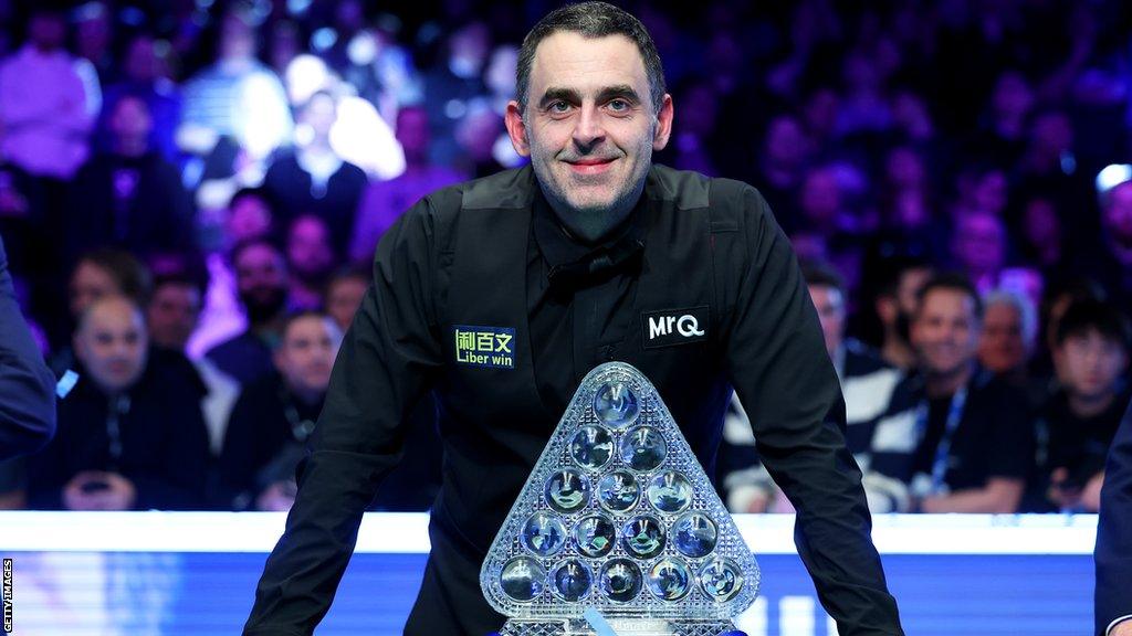 Ronnie O'Sullivan poses with the trophy after winning the 2023 Masters with victory over Ali Carter