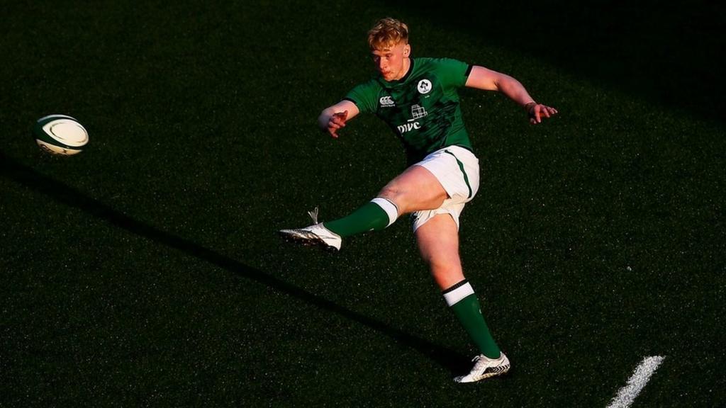 Jamie Osborne of Ireland clears the ball from their 22