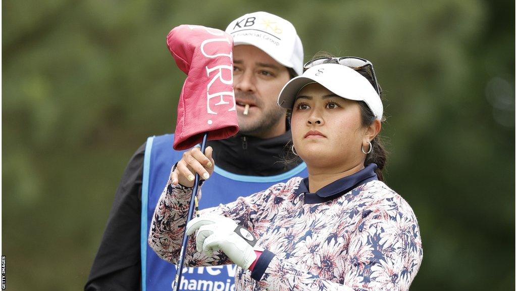 Lilia Vu watching on with her caddy in the background