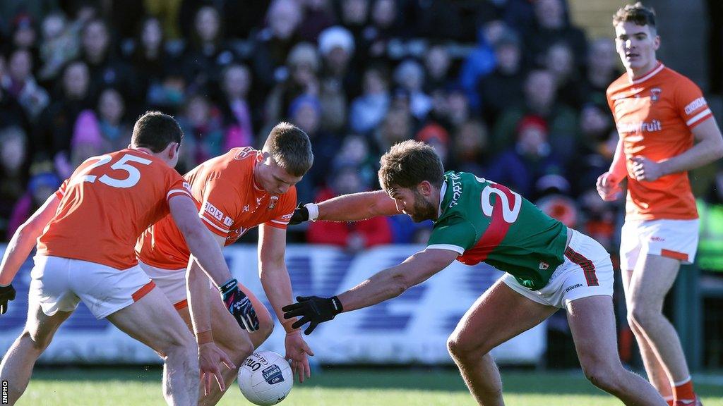 Mayo's Aidan O'Shea challenges Armagh's Rian O'Neill