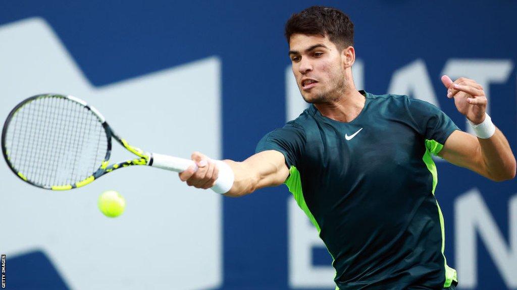 Carlos Alcaraz returns the ball against Tommy Paul at the Canadian Open