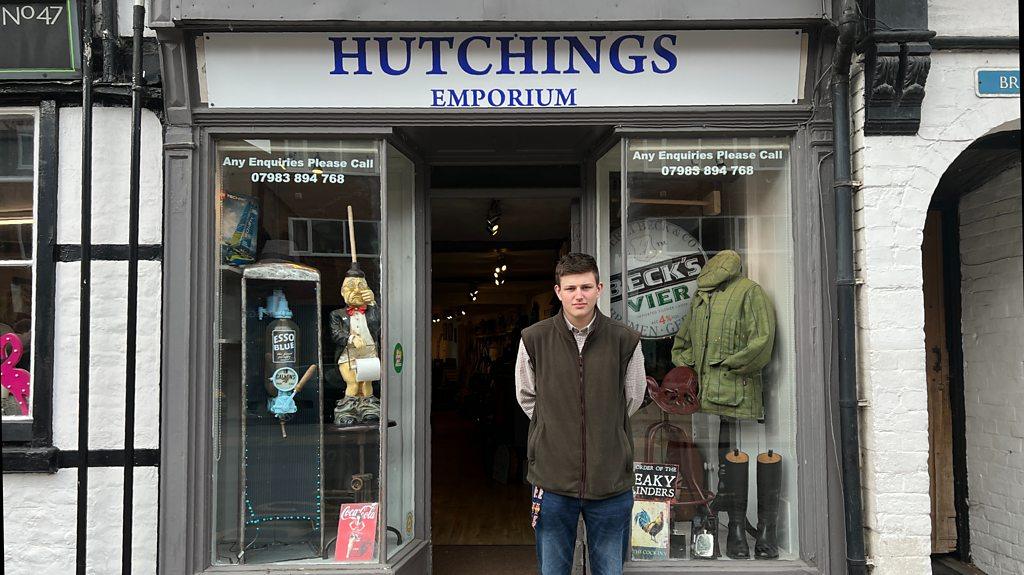 16-year-old Finley stood outside his shop Hutchings Emporium