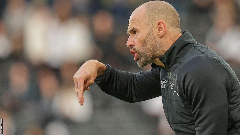 Derby County manager Paul Warne watched from the dugout as the Rams lose to Blackpool