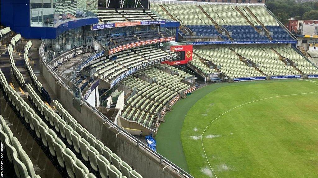 Overnight rain at Edgbaston left puddles on the outfield