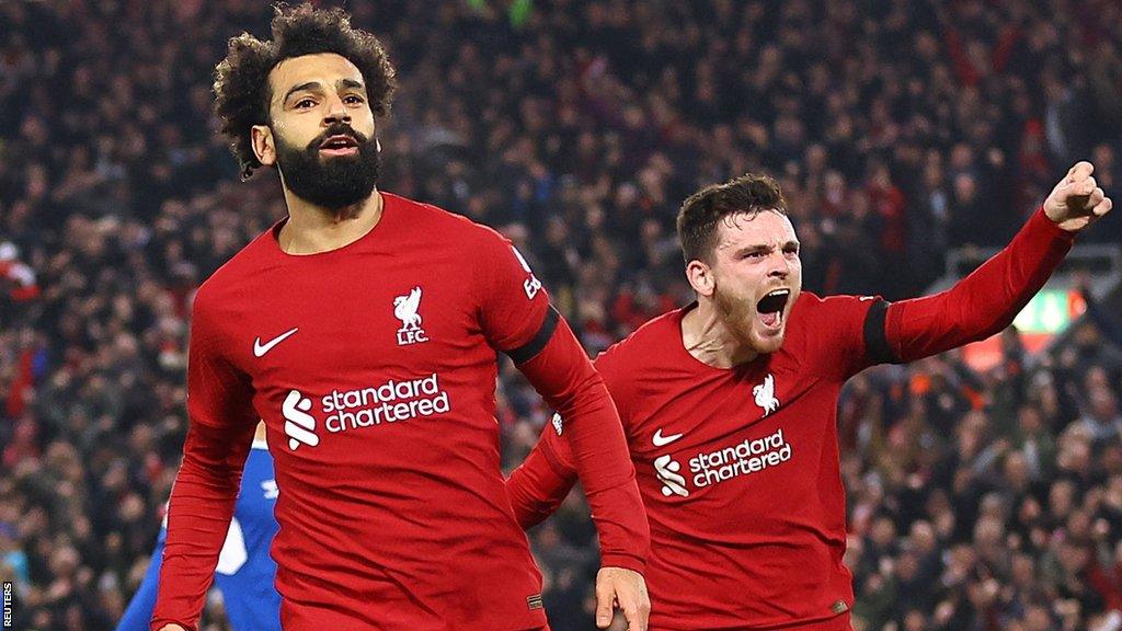 Mohamed Salah and Andy Robertson celebrate after Liverpool take the lead against Everton at Anfield