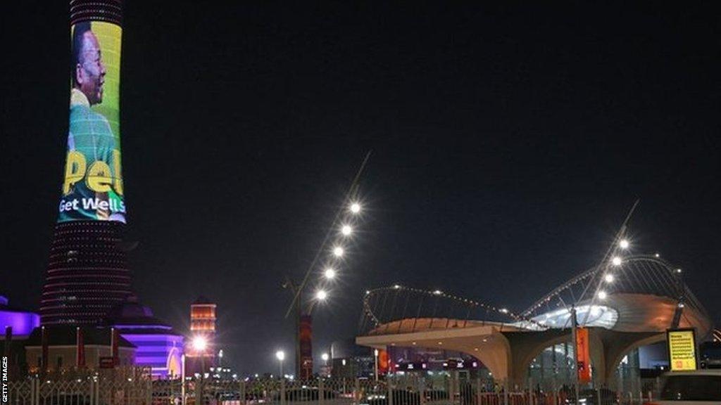 Doha's Torch tower, also known as the Aspire Tower, lit by a screen depicting Pele and reading a message in support of the former Brazil player