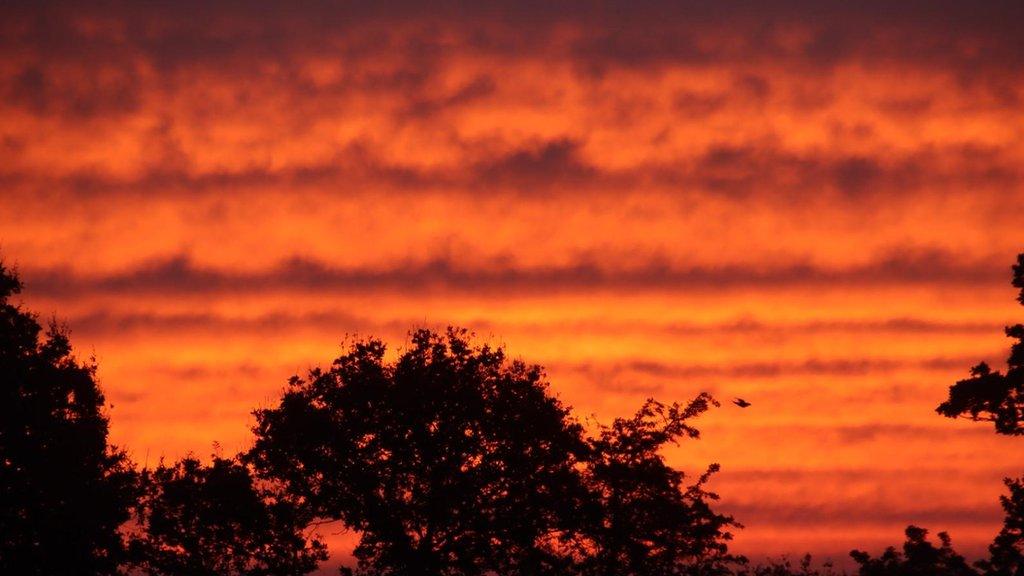 Red skies at sunrise in Clacton-on-Sea, Essex.