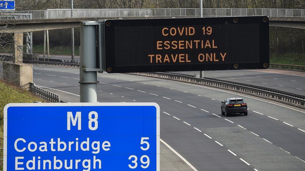 Road with Covid sign