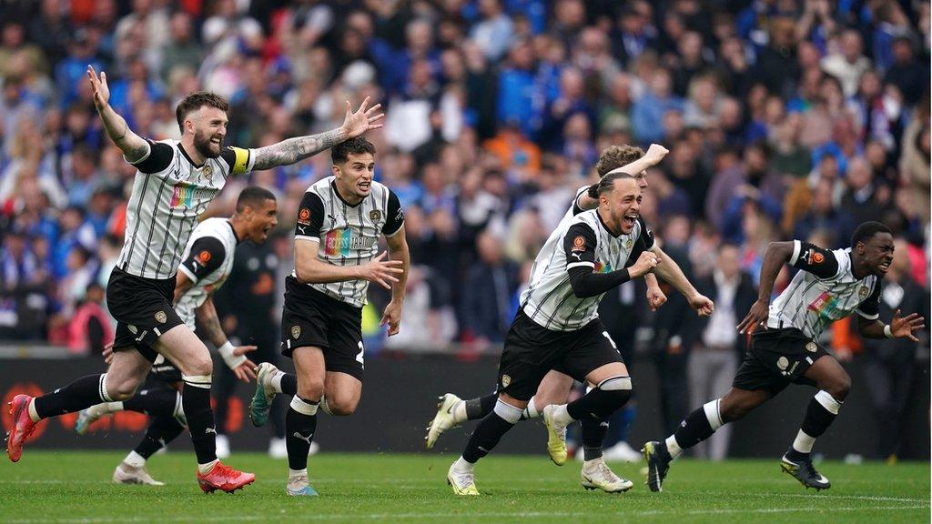 Notts County players celebrate after their penalty shootout win the National League promotion final