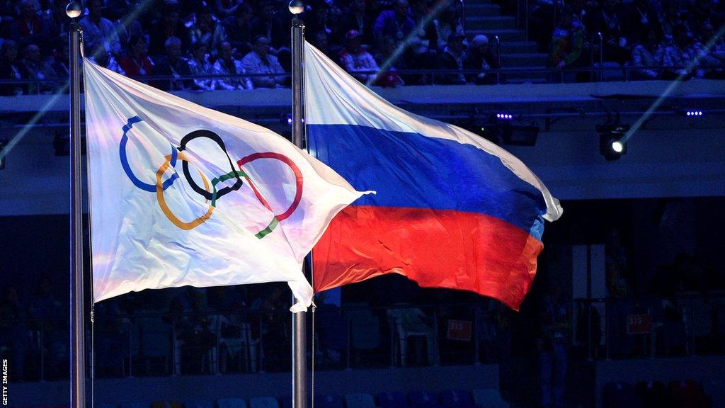 The Russia flag and alongside a flag showing the Olympic logo