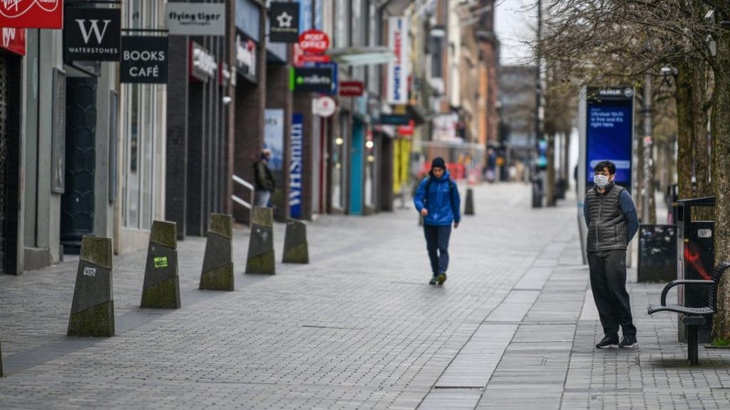 Men on empty street