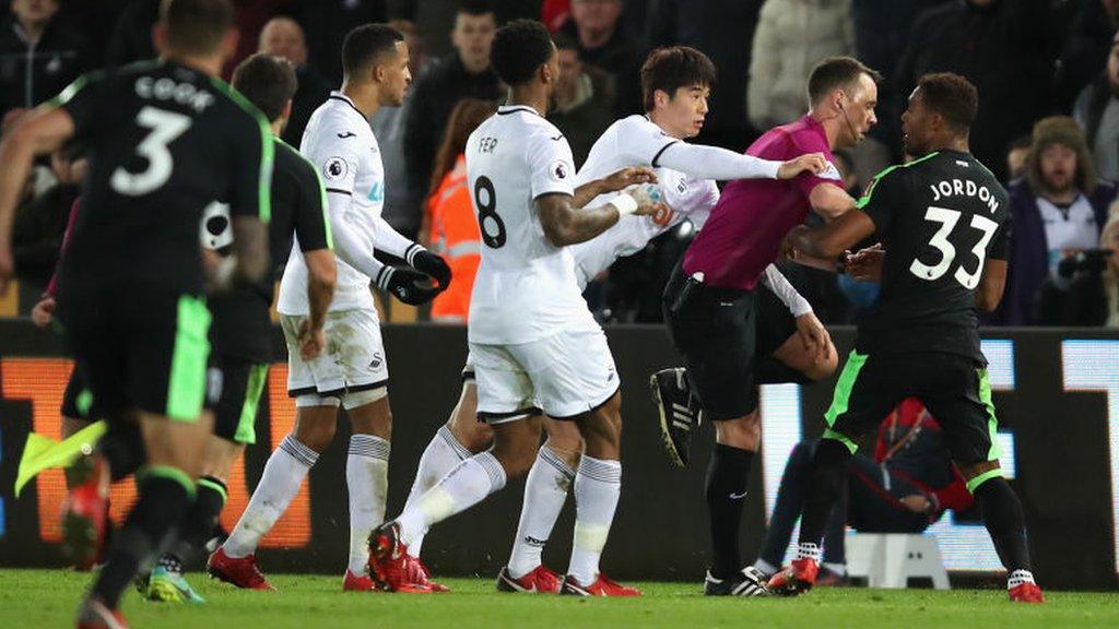 Swansea City and AFC Bournemouth players clash