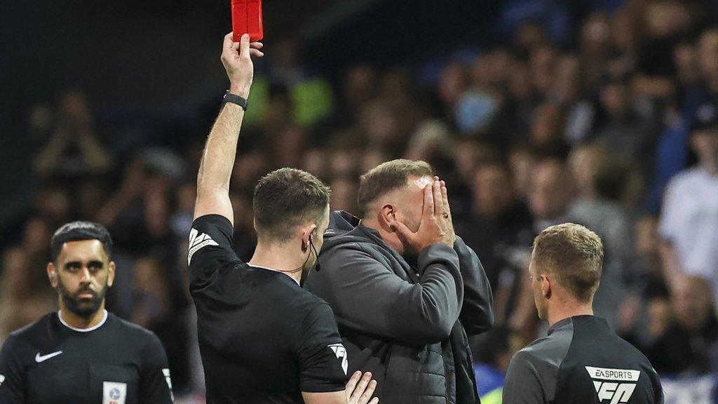 Bolton boss Ian Evatt holds his face to his hands after his dismissal against Fleetwood