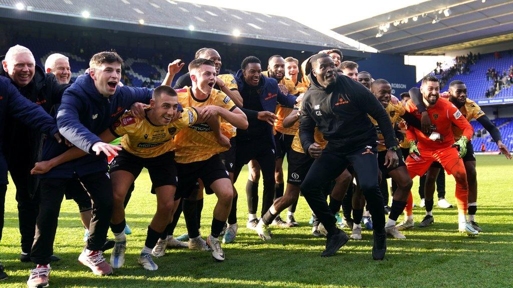 Maidstone United celebrate at Portman Road after beating Ipswich Town.