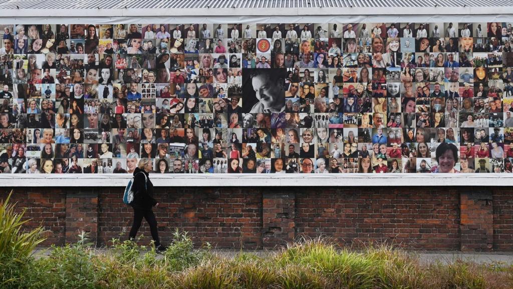 Key workers on a mural in Barrow