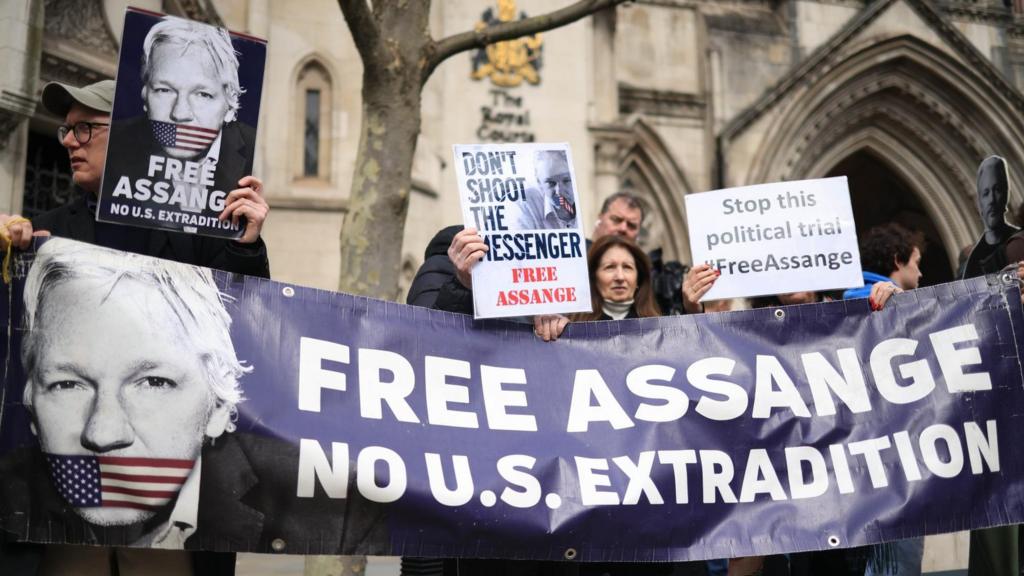 Julian Assange supporters protest outside the Royal Courts of Justice in Londo