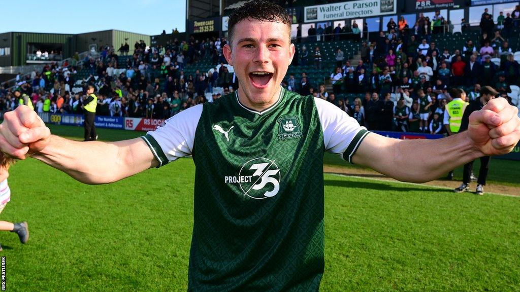 Adam Randell celebrates Plymouth Argyle's promotion to the Championship