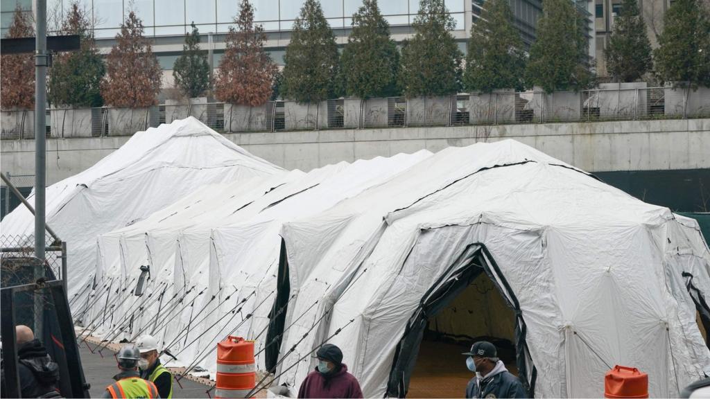 Workers build a makeshift morgue outside of Bellevue Hospital to handle an expected surge in Coronavirus victims on March 25, 2020 in New YorK