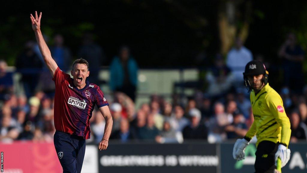 Kent bowler Michael Hogan celebrates taking a wicket