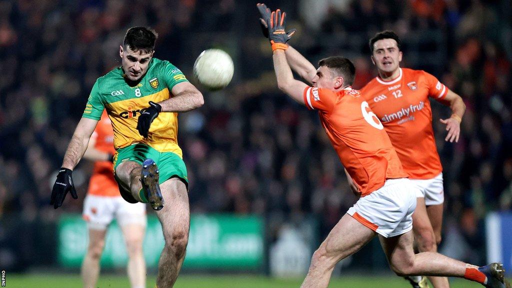 Armagh's Greg McCabe attempts to block a shot by Donegal's Caolan McGonagle