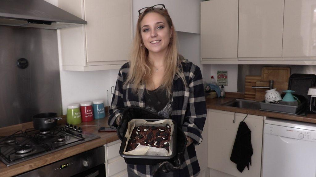 Immy Ray holding a cake taken out the oven