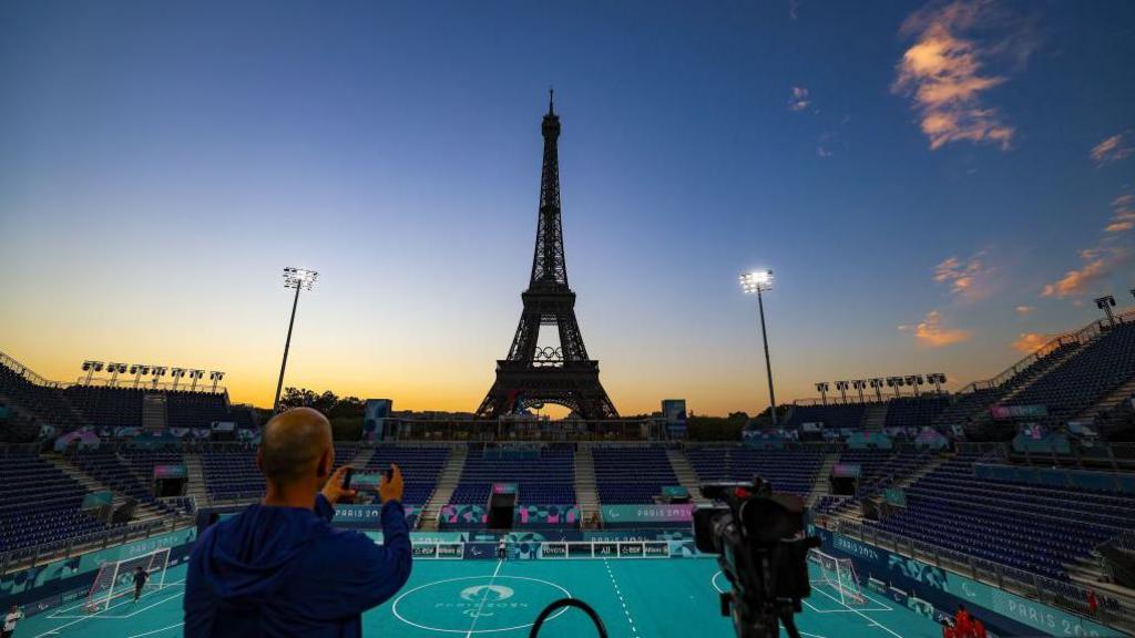 people watching sunset in paris