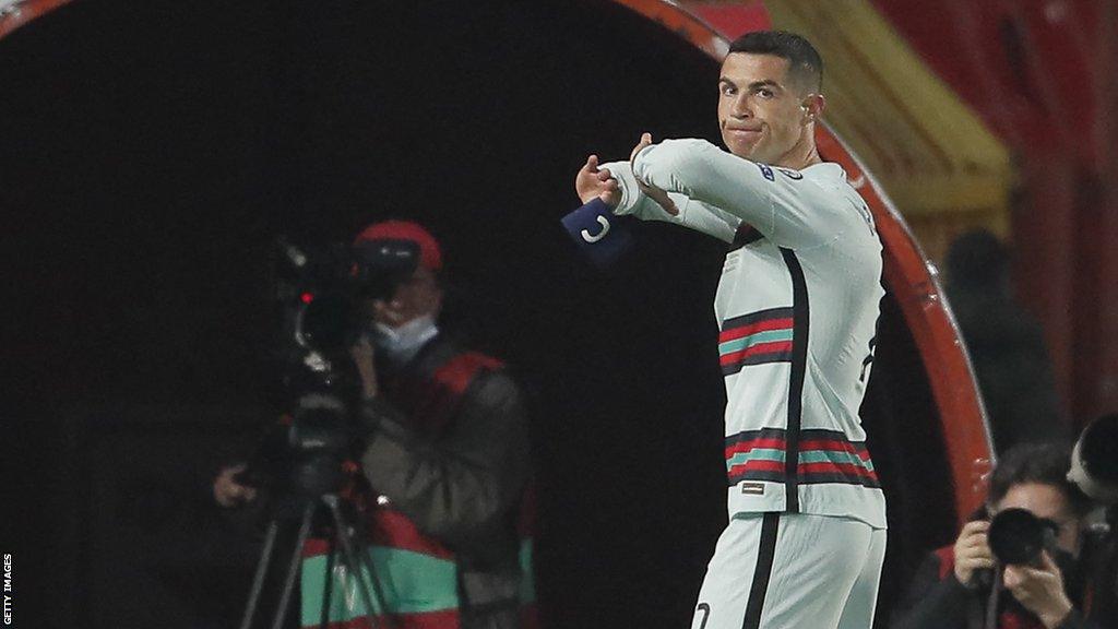 Ronaldo peels off the captain's armband before tossing it to the ground