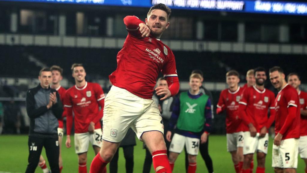 Crewe players celebrate beating Derby